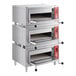 A stack of silver Avantco triple deck countertop bakery ovens.