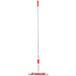 A Unger Restroom Complete Mop with a red and white mop with a long white pole and a red top.