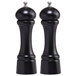 A black pepper mill and salt mill set with silver tops.