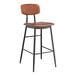 A Lancaster Table & Seating mid-century black barstool with a cognac vinyl padded seat and backrest.