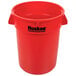 A red Huskee 32 gallon round trash can with black text on the side.