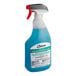 A white plastic spray bottle of blue SC Johnson Professional Non-Acid Toilet Bowl and Bathroom Cleaner.