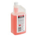 A bottle of SC Johnson Professional Heavy-Duty Neutral Floor Cleaner with a red cap filled with pink liquid.