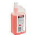A quart-sized bottle of pink SC Johnson Professional Heavy-Duty Neutral Floor Cleaner with a red cap.