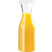 A Cal-Mil polycarbonate carafe filled with orange juice.
