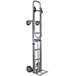 A silver metal B&P Manufacturing hand truck with wheels and a handle.