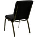 A Flash Furniture black church chair with gold polka dot fabric on the seat and back.