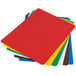 A stack of colored plastic cutting boards.