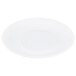 A white saucer with a circular pattern on it.