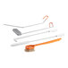 A white and orange Fryclone deep fryer cleaning kit with brushes, a clean out rod, and a crumb scoop.