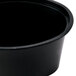 A black plastic Newspring Ellipso souffle container.