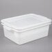 A white plastic Vollrath perforated drain box with a lid.