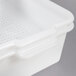 A white plastic Vollrath perforated drain box.