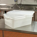 A white plastic Vollrath drain box kit on a table.