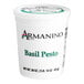 A white Armanino container of basil pesto sauce.