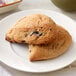 Two Pillsbury blueberry scones on a white plate.