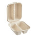 A white World Centric compostable fiber taco clamshell with two compartments.