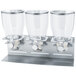 A Zevro professional silver triple dry food dispenser on a metal stand with three glass jars.