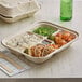 A World Centric eco-friendly compostable bento box with 5 compartments holding rice, chicken, and vegetables.