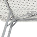 A National Public Seating speckled gray plastic seminar table with metal legs.