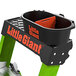 A black bucket with a Little Giant orange label on a green Little Giant ladder.