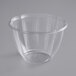 A Stalk Market clear plastic salad bowl on a white surface.