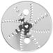 A Waring reversible grating / shredding disc, a circular metal object with holes.