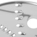 A Waring reversible grating / shredding disc with circular metal grating holes.