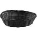 A Tablecraft black oval rattan basket with handles.
