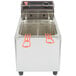 A Cecilware stainless steel commercial countertop deep fryer with red handles.
