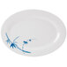 A white oval melamine platter with blue bamboo leaves on it.