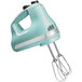 Aqua sky KitchenAid 5-speed hand mixer with a whisk attachment on a white background.