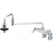 A T&S chrome wall mount pot filler faucet with a single handle.