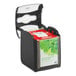A black and white box with a red and white label for Tork Xpressnap Fit 7232000 Black Tabletop Interfold Napkin Dispenser.