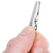 A person holding a stainless steel alligator clip.