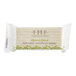 A wrapped FarmHouse Fresh Botanical Blend bar of soap with green leaves.