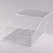 A clear plastic Cal-Mil food bin with a removable divider on a bakery display counter.