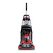 A Hoover PowerScrub CH68000V carpet spotter with red and black trim.