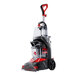 A red and black Hoover carpet spotter with a handle and wheels.