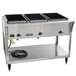 A Vollrath stainless steel electric hot food table with three pans.