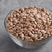 A bowl of dried pinto beans.