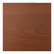 A close-up of a Perfect Tables outdoor cherry woodgrain table top.