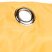 A close-up of a yellow vinyl bag with a metal ring.