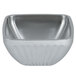 A silver stainless steel fluted Vollrath serving bowl with a white background.
