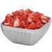 A Vollrath fluted metal bowl filled with strawberries.