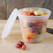A Pactiv translucent plastic deli container filled with fruit.