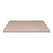 A close-up of a Perfect Tables indoor square smooth concrete table top in beige.