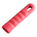 A red silicone handle with a hole in it.