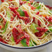 A bowl of pasta with Sevillo Fine Foods sundried julienne tomato strips.