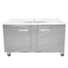 A Traulsen stainless steel refrigerated sandwich prep table with two doors and two drawers.